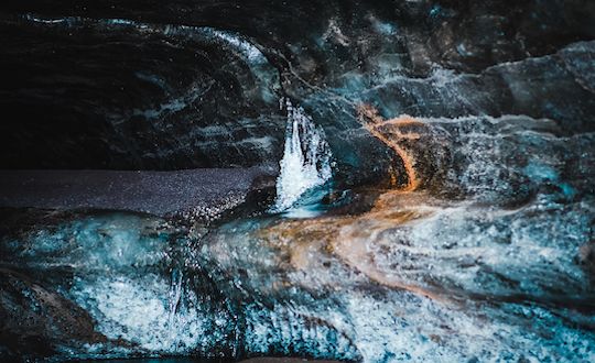 Ice Cave & Snowmobile From Gullfoss